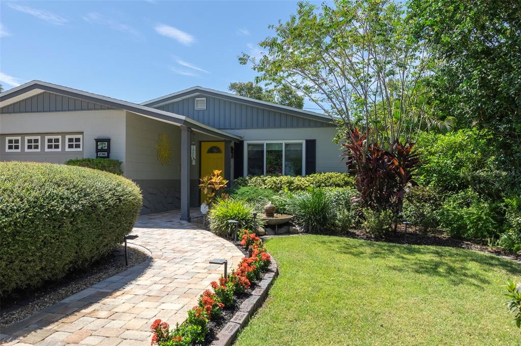 a front view of a house with garden