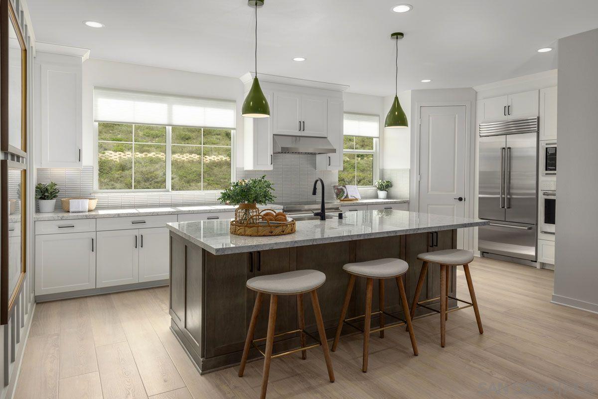 a kitchen with a sink stove and refrigerator