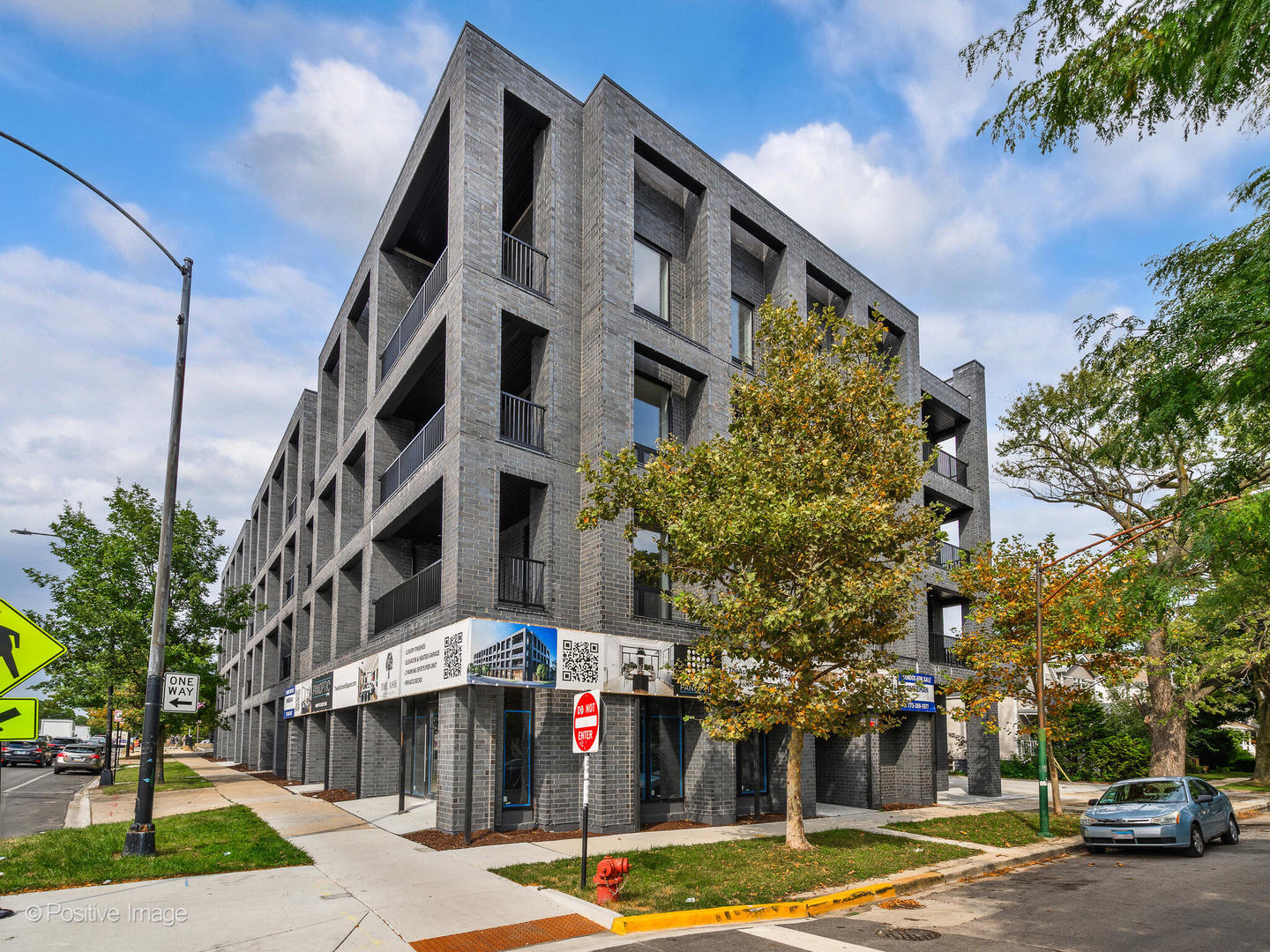 a front view of a building with street view