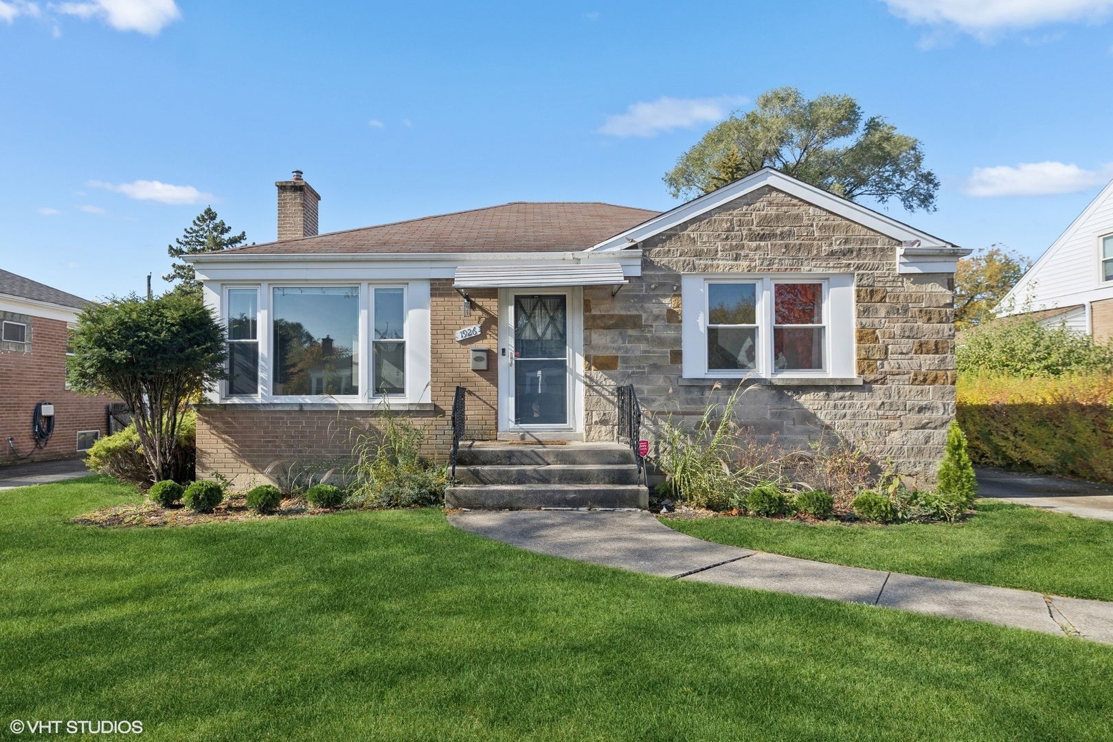 front view of a house with a yard