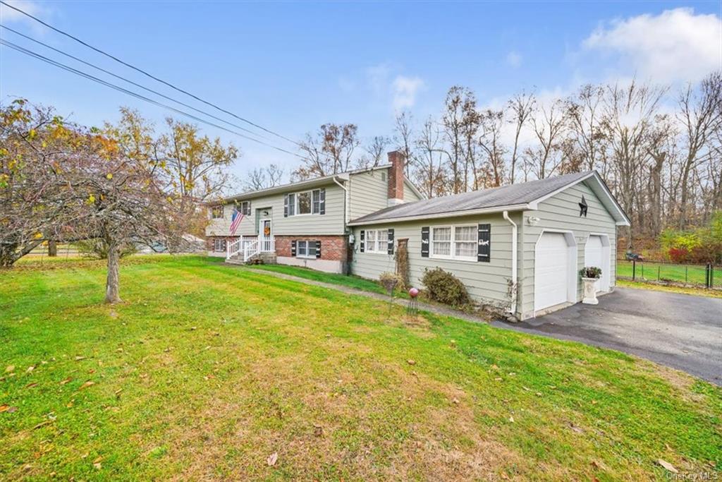 a view of a house with a big yard