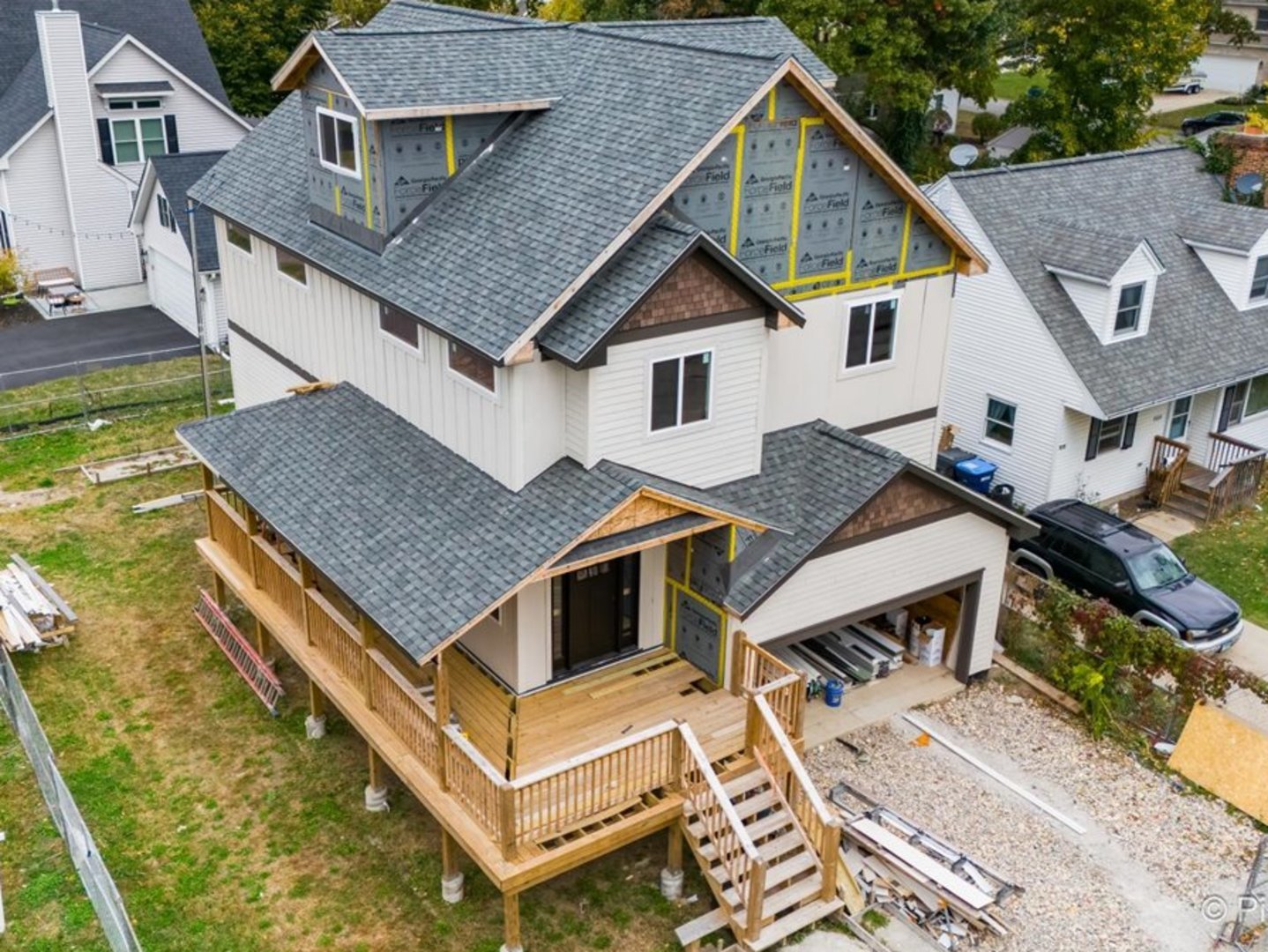 a aerial view of a house with a yard