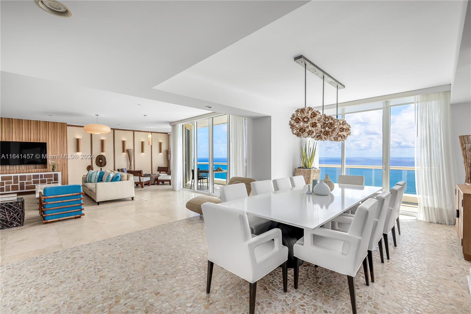 a view of a dining room with furniture wooden floor and chandelier