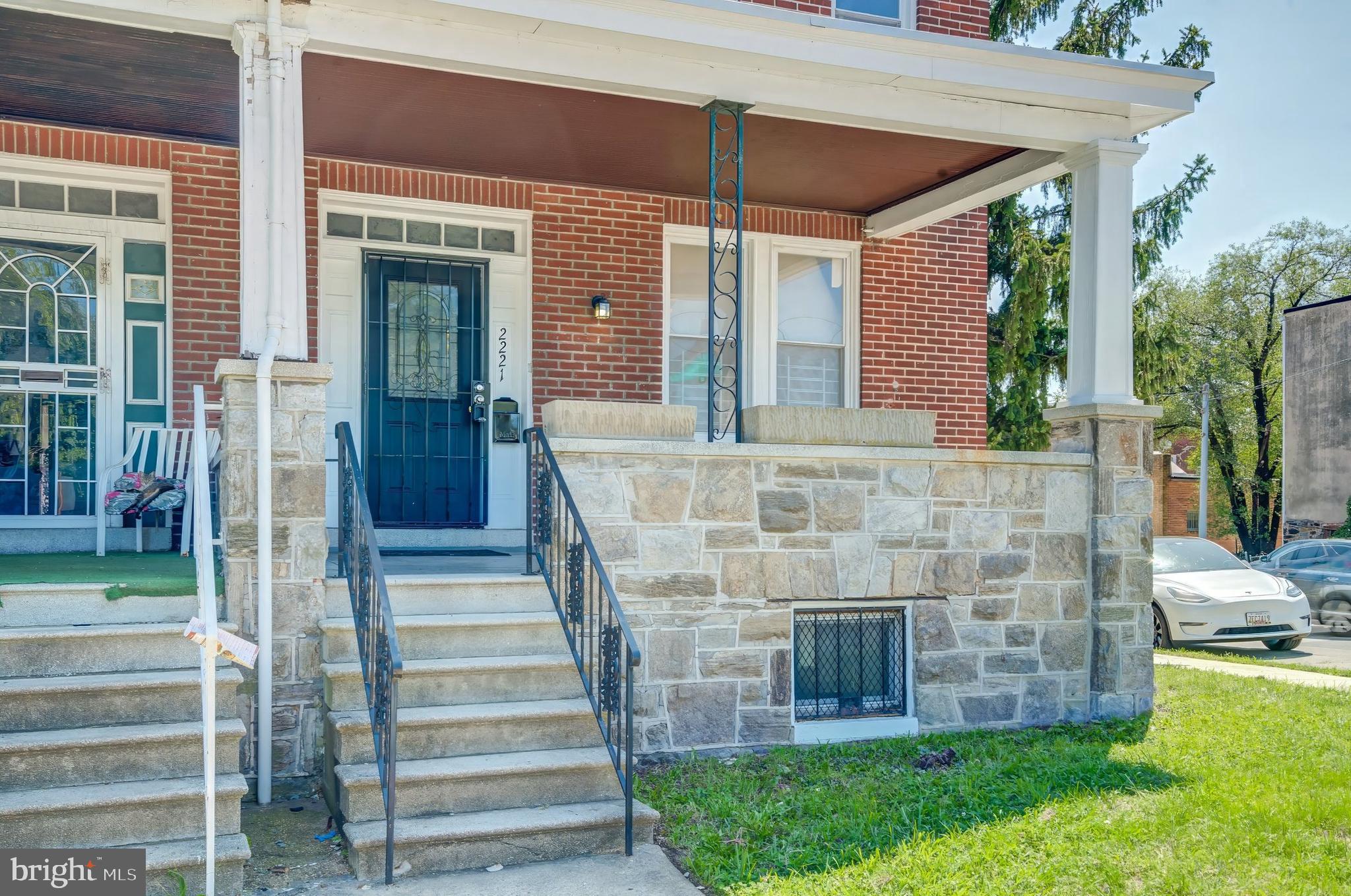 a view of house with front door and porch