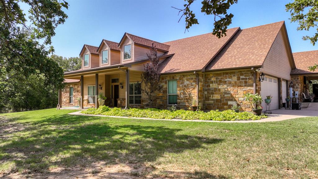 front view of a house with a yard