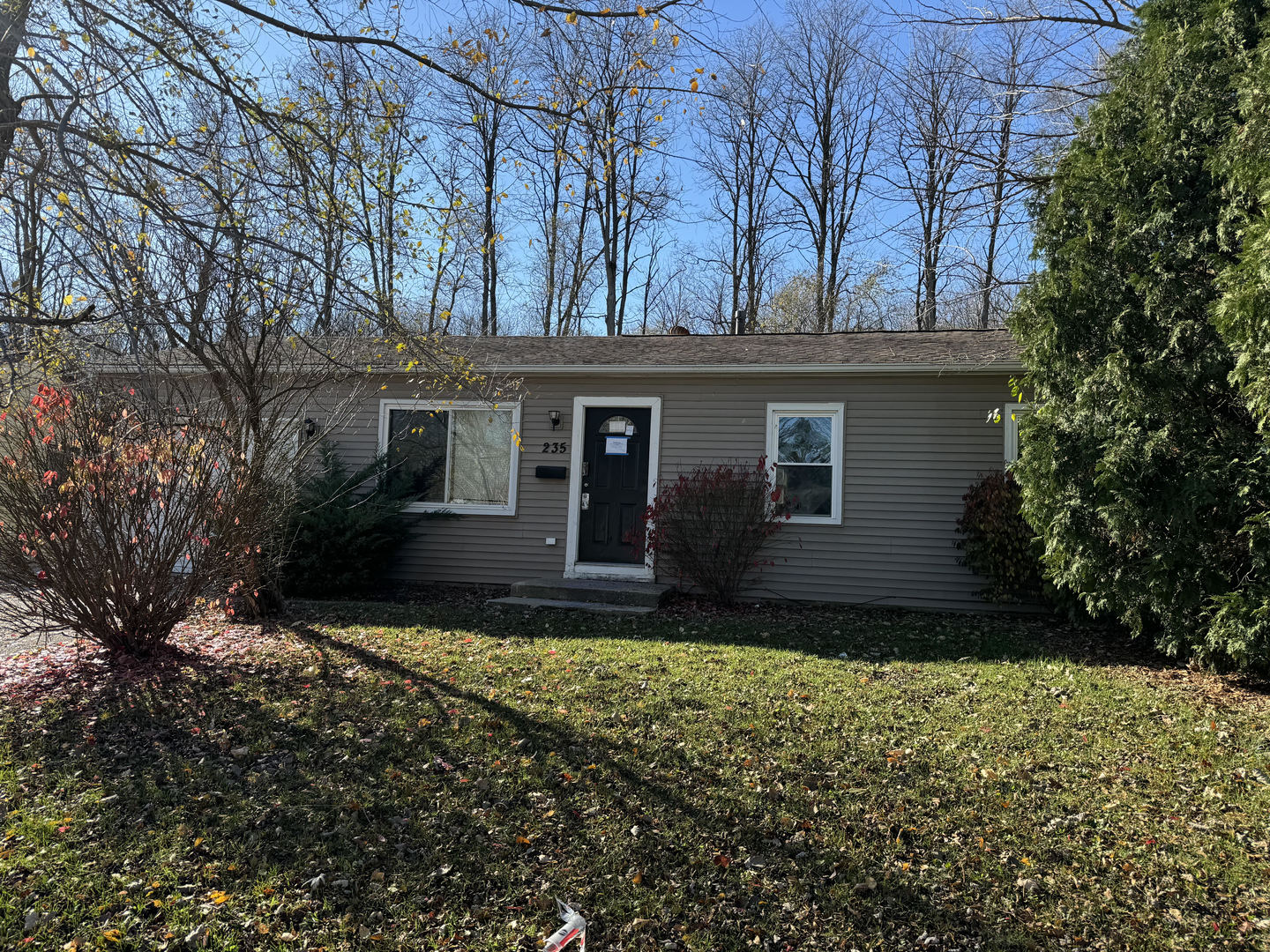 front view of a house with a yard