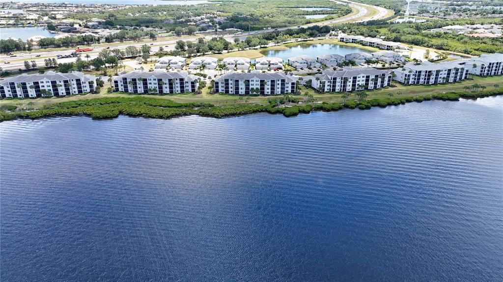 an aerial view of residential building and lake view