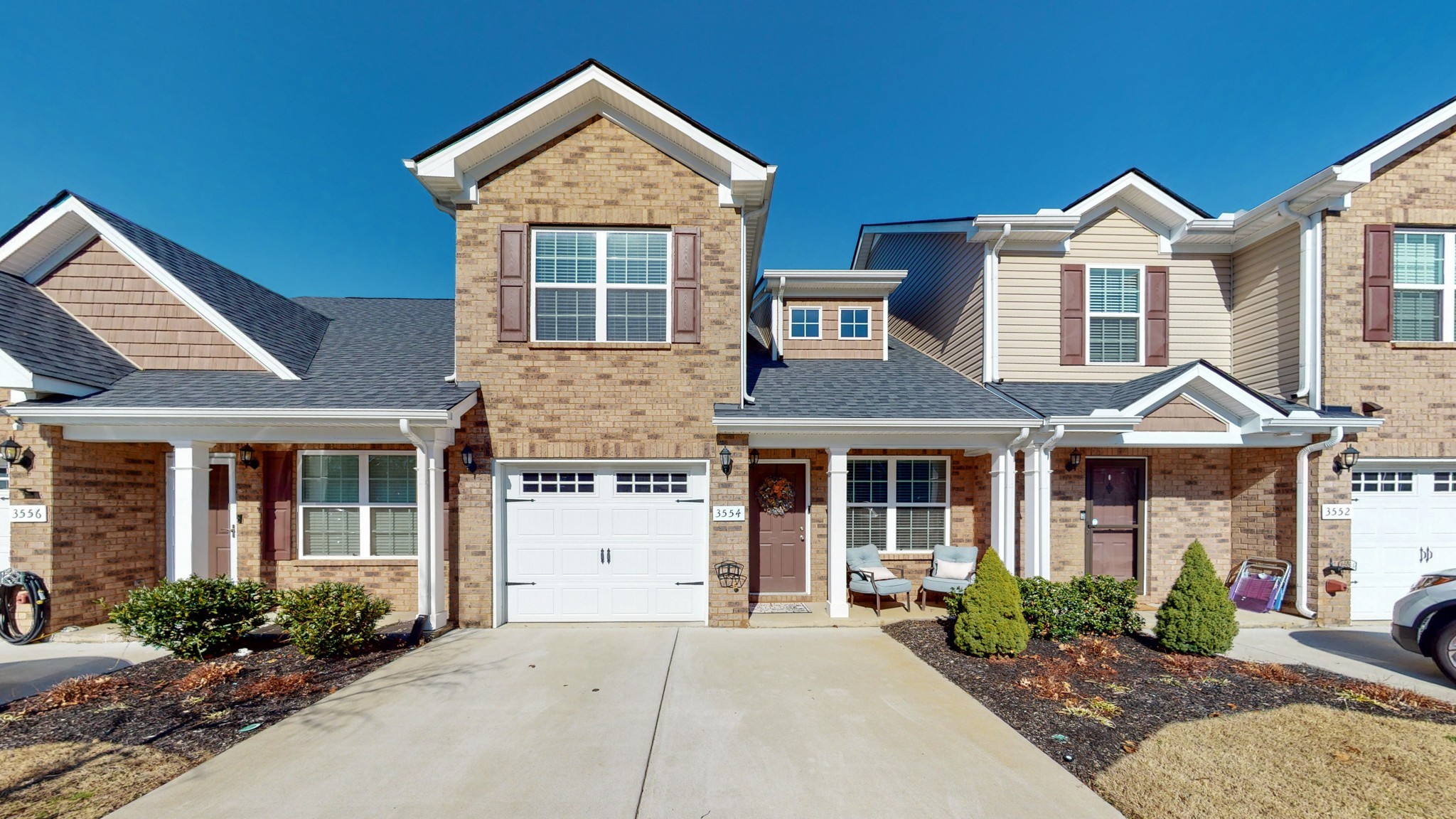 a front view of a house with a yard