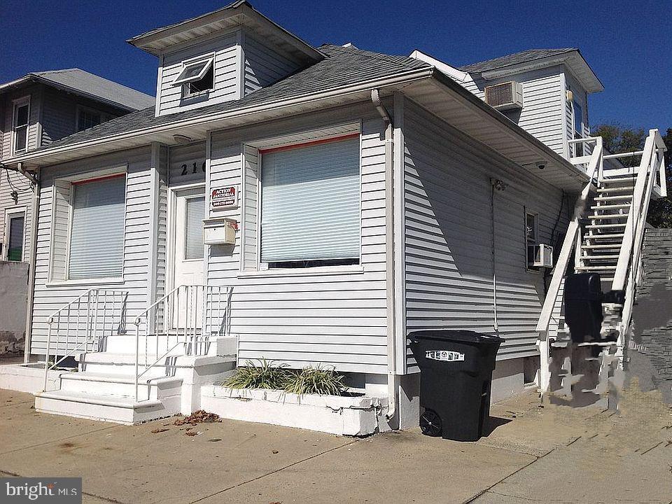 a view of a house with a bench