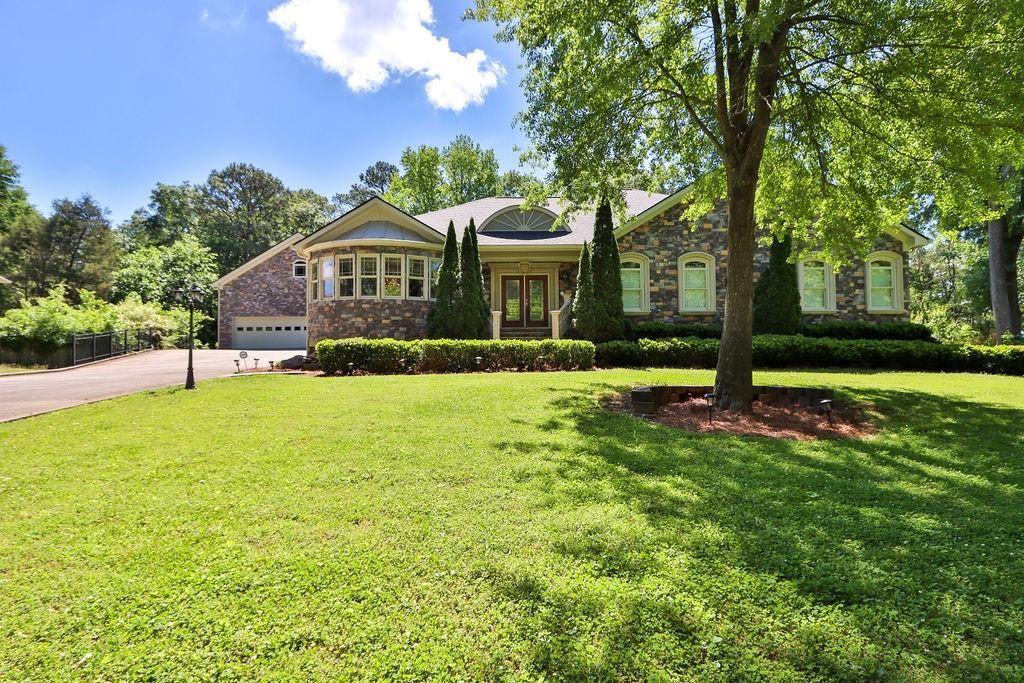 a front view of a house with a yard