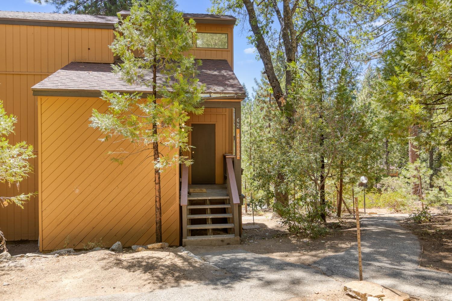 a view of a house with a tree