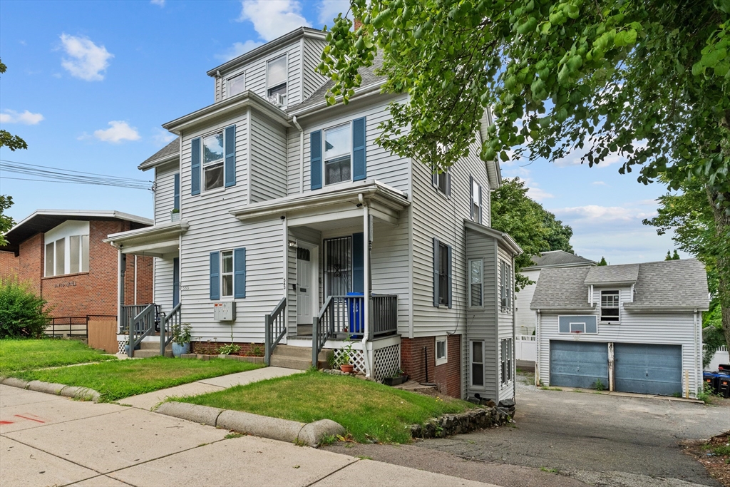 front view of a house with a yard