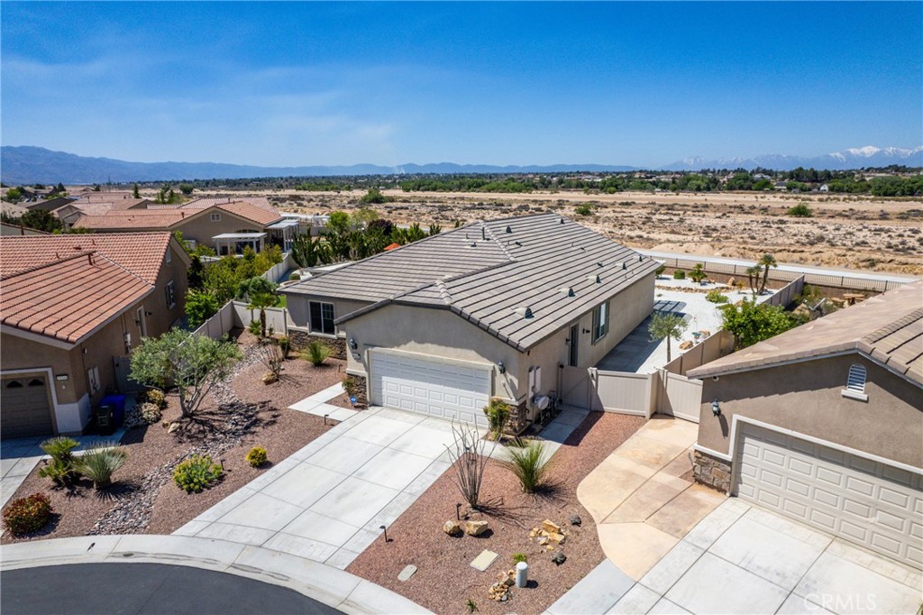 an aerial view of a house with a garden