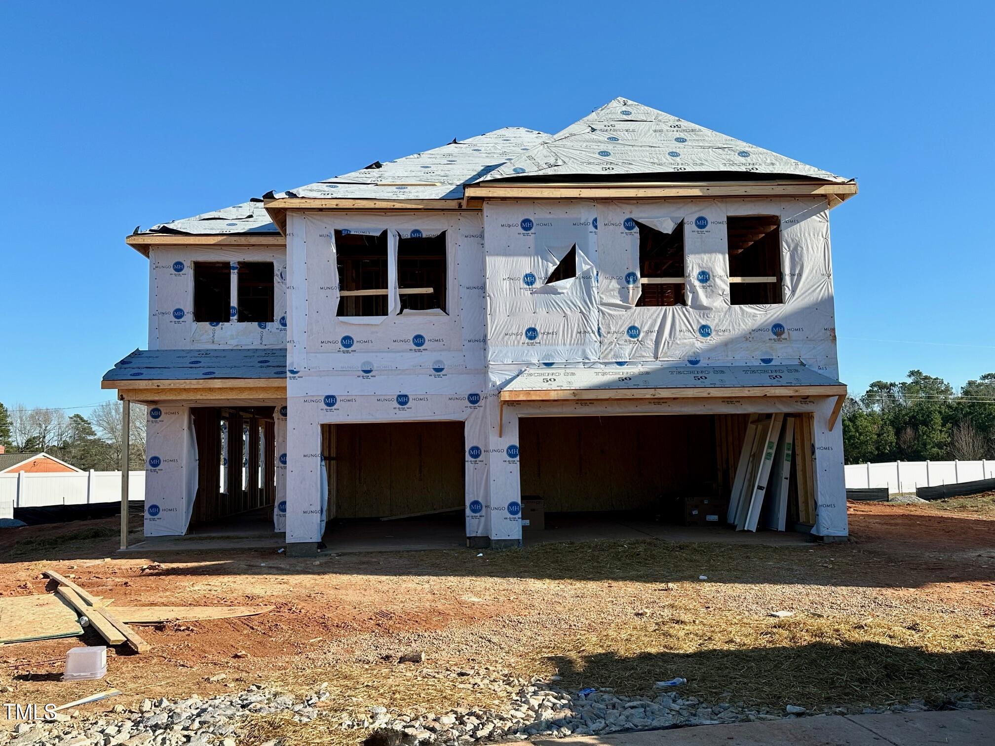 a front view of a house with a garage