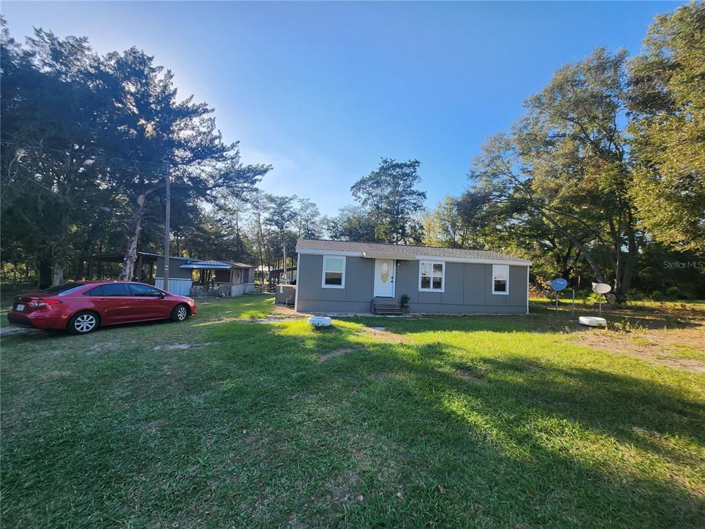 a view of a house with a big yard