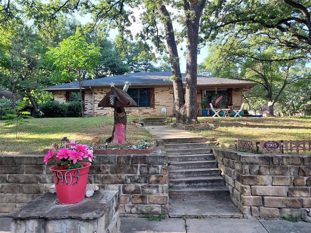 a front view of a house with a yard and a garage