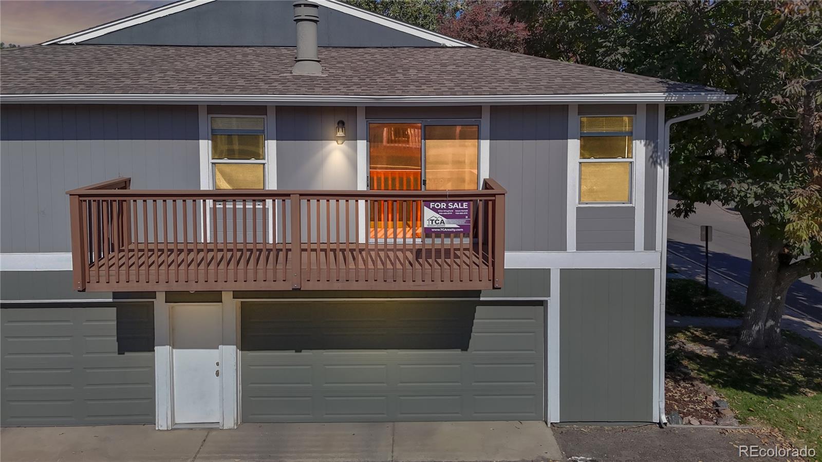 a front view of a house with garage