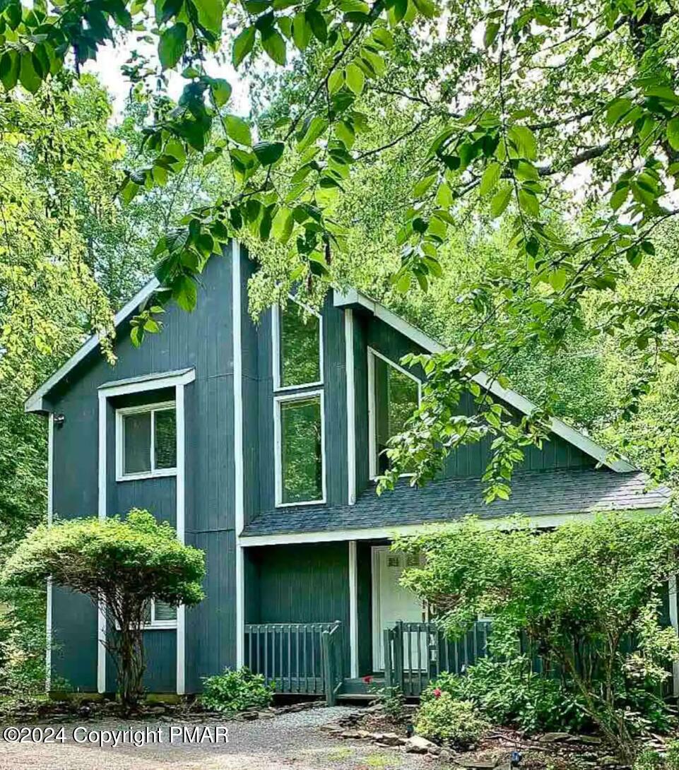 a house with trees in front of it