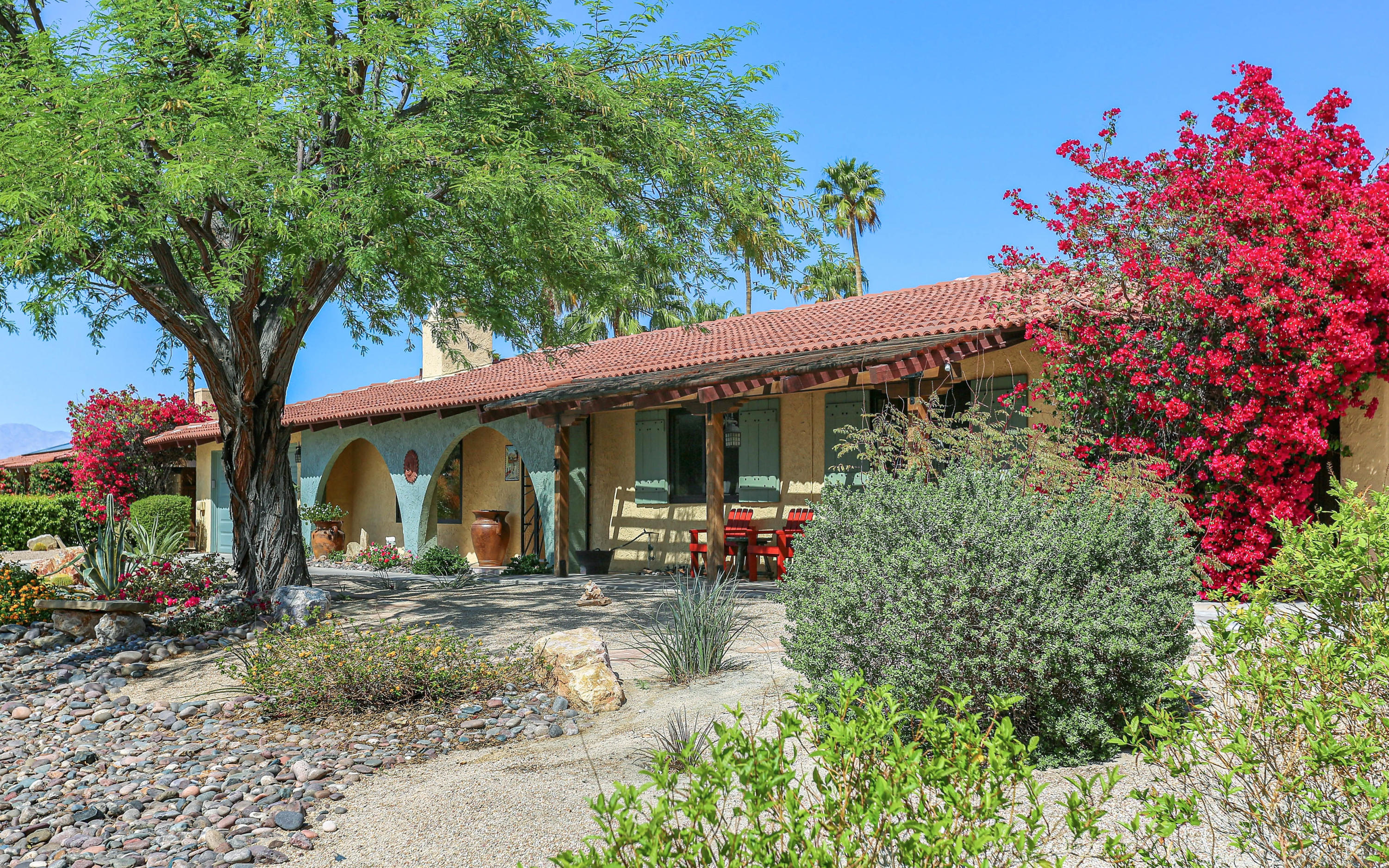 a front view of a house with garden