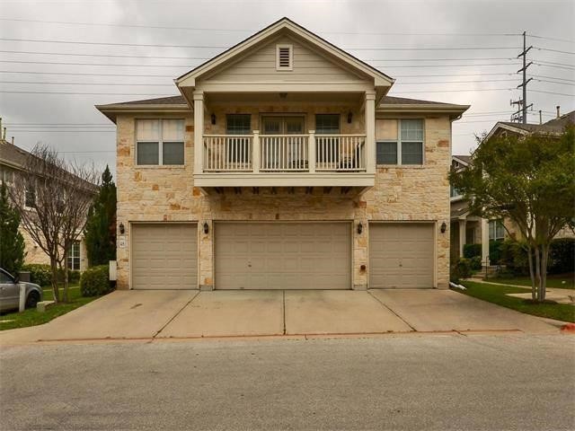 a front view of a house with a garage