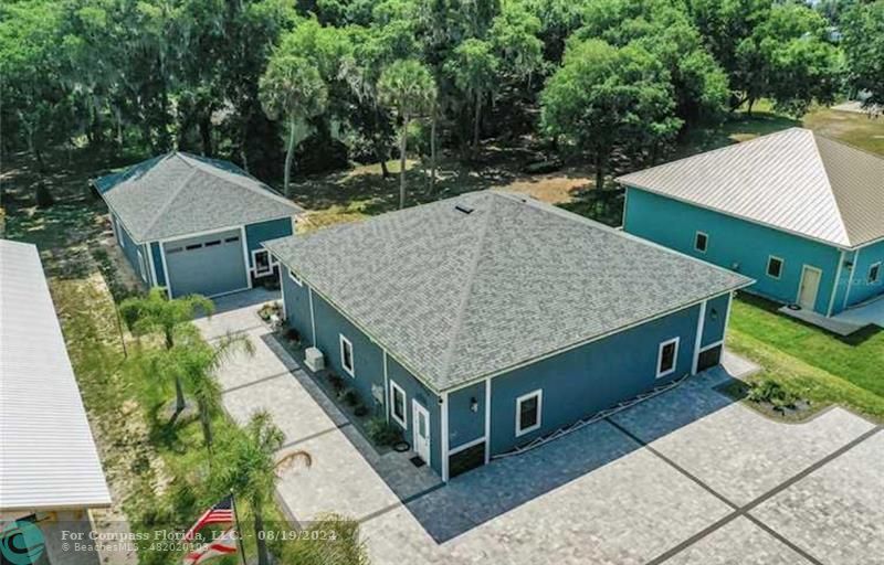 an aerial view of a house having yard