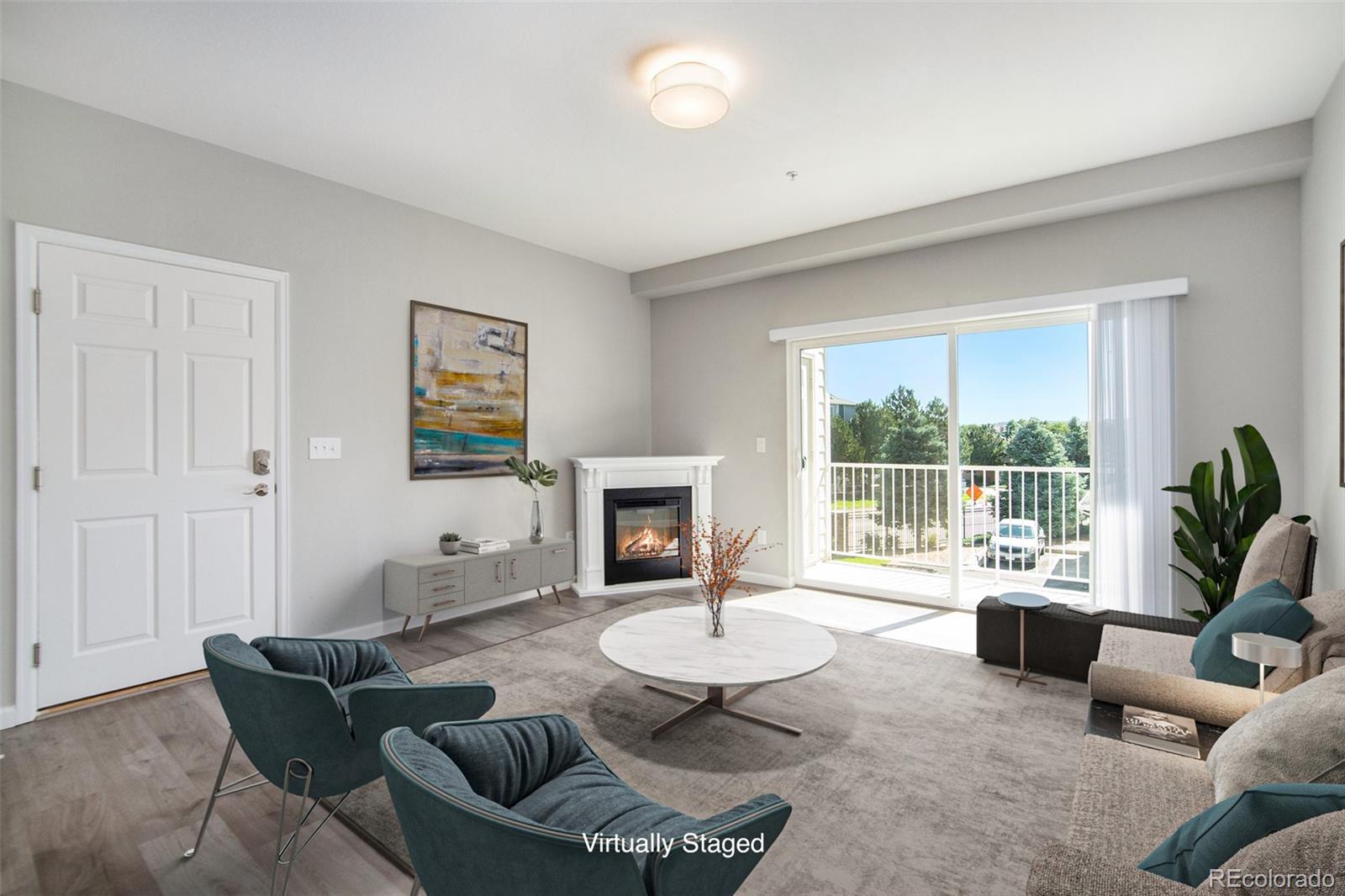 a living room with furniture and a fireplace