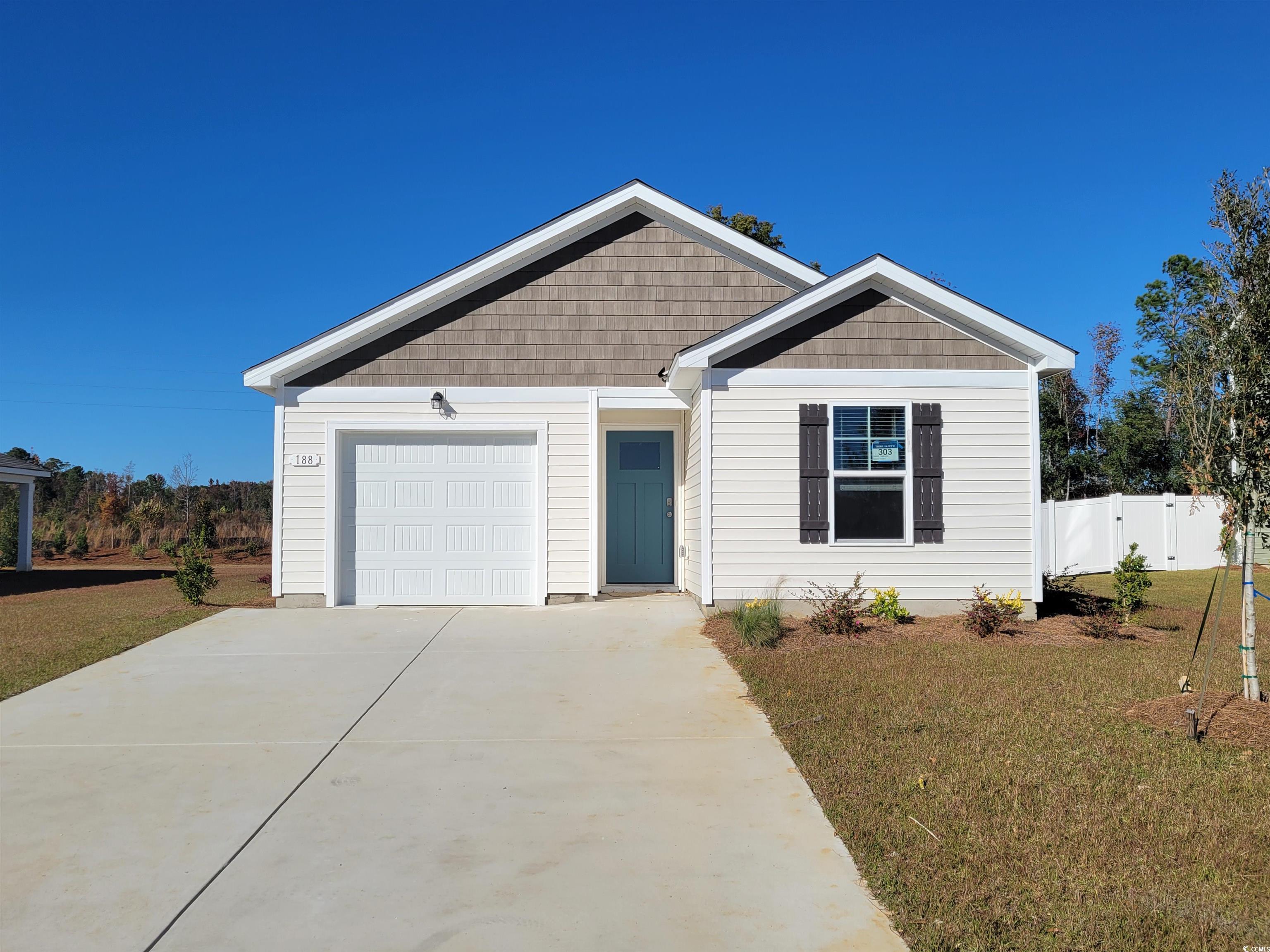 View of front of property with a garage and a fron