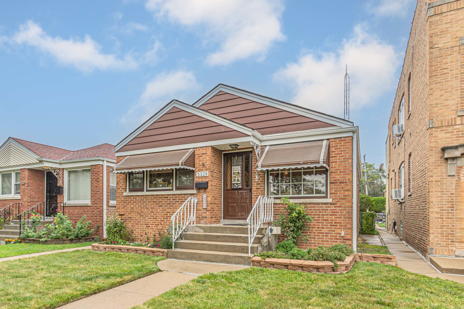 front view of a house with a yard