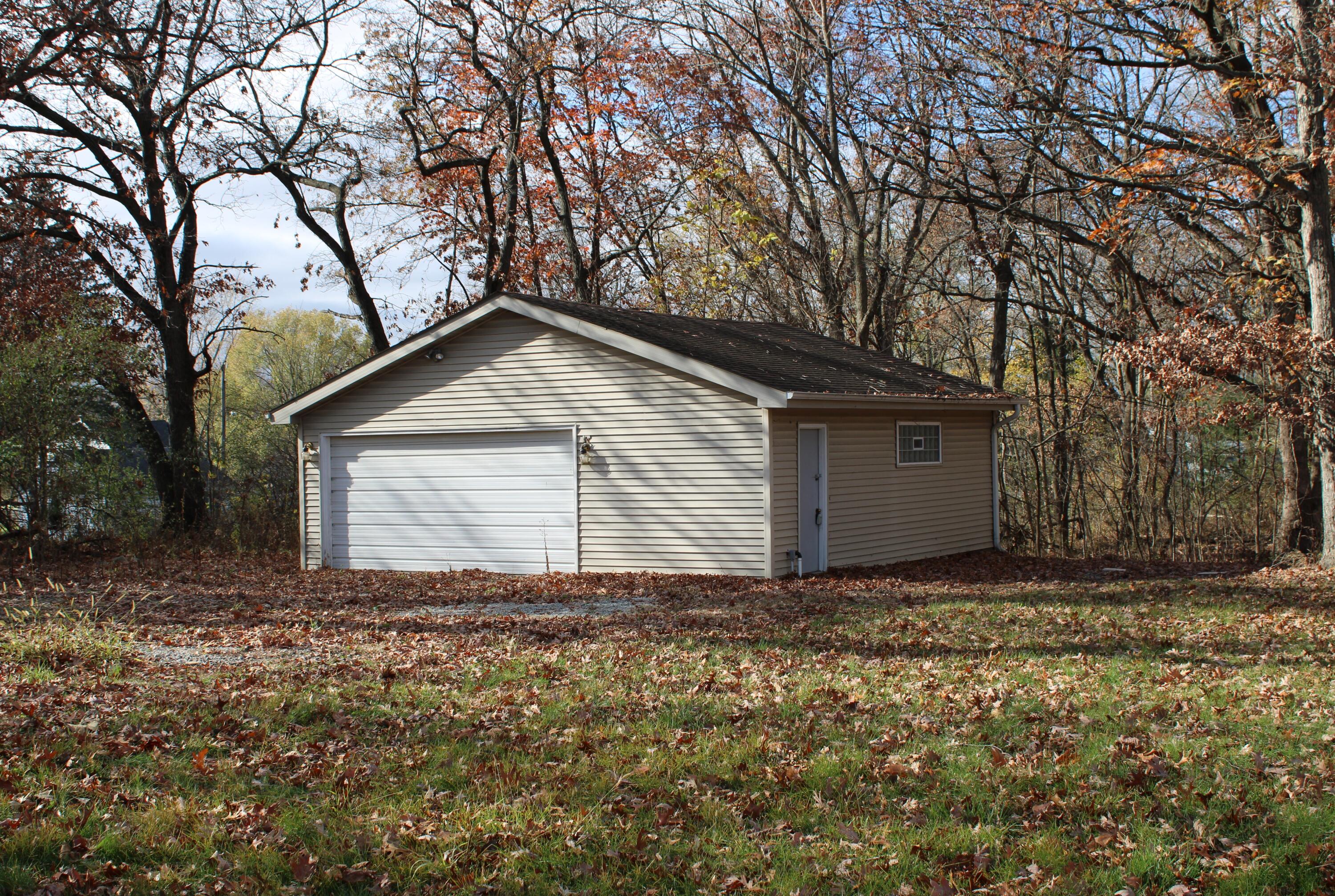 a view of house with yard