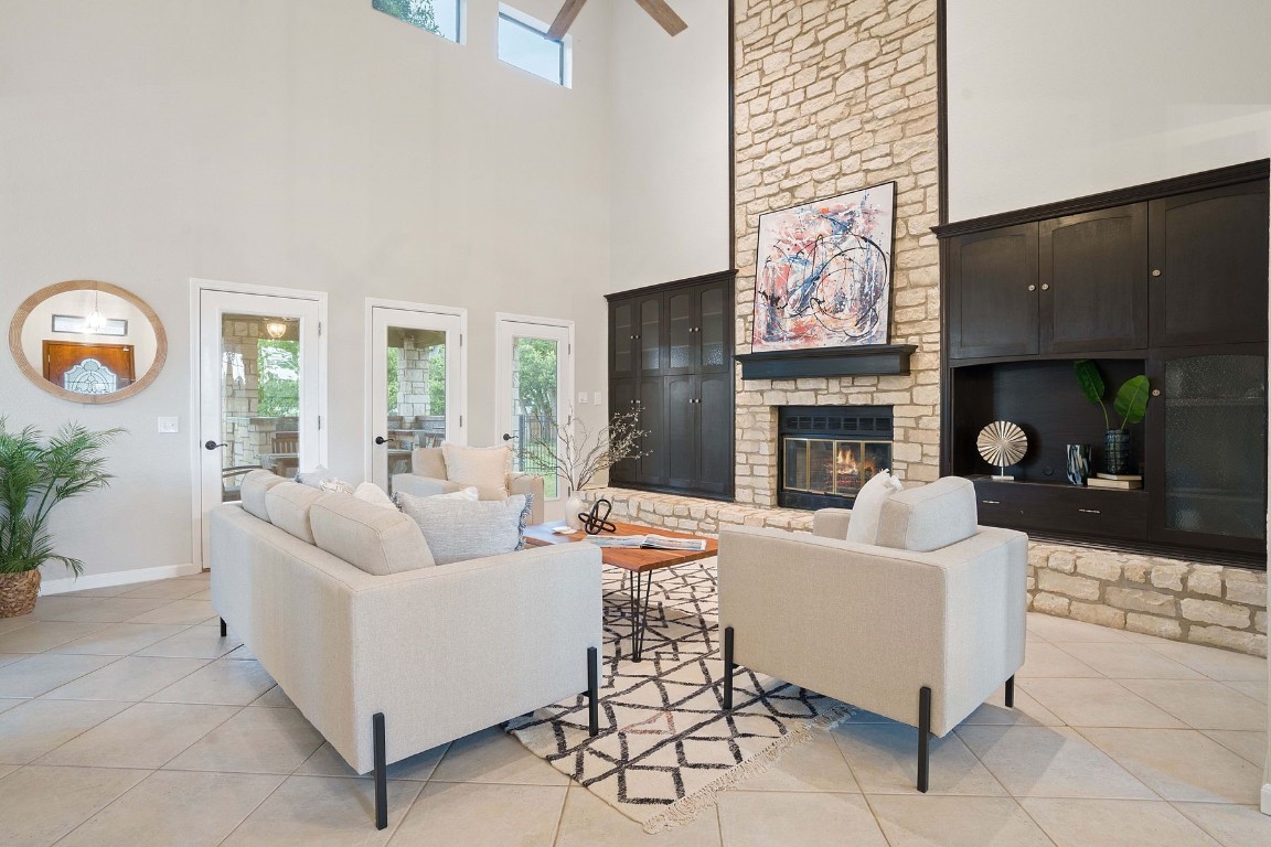 a living room with fireplace furniture and a fireplace