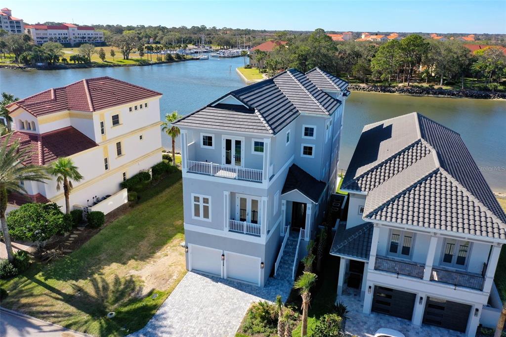 an aerial view of a house with a lake view