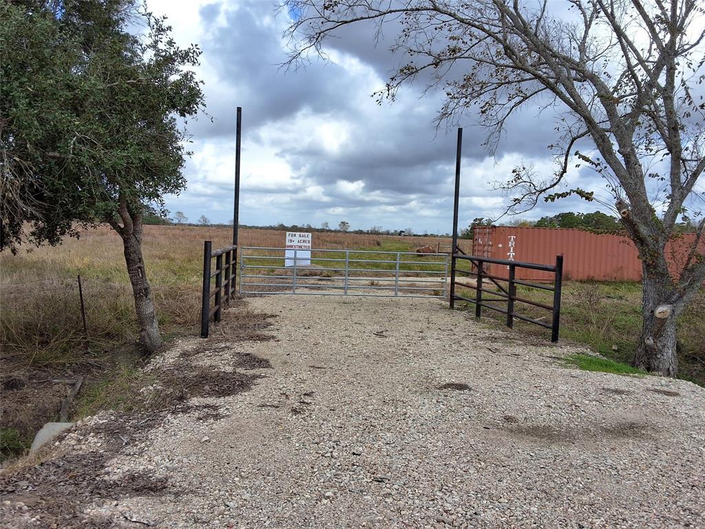 20 acre lot from driveway showing the ranch gate.