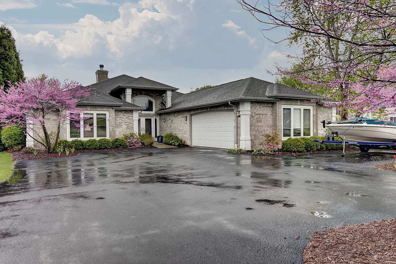 a front view of a house with garden