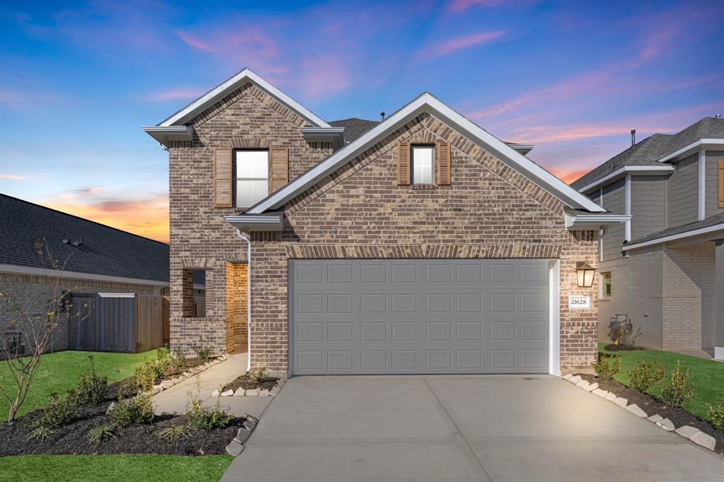 a front view of a house with a garage