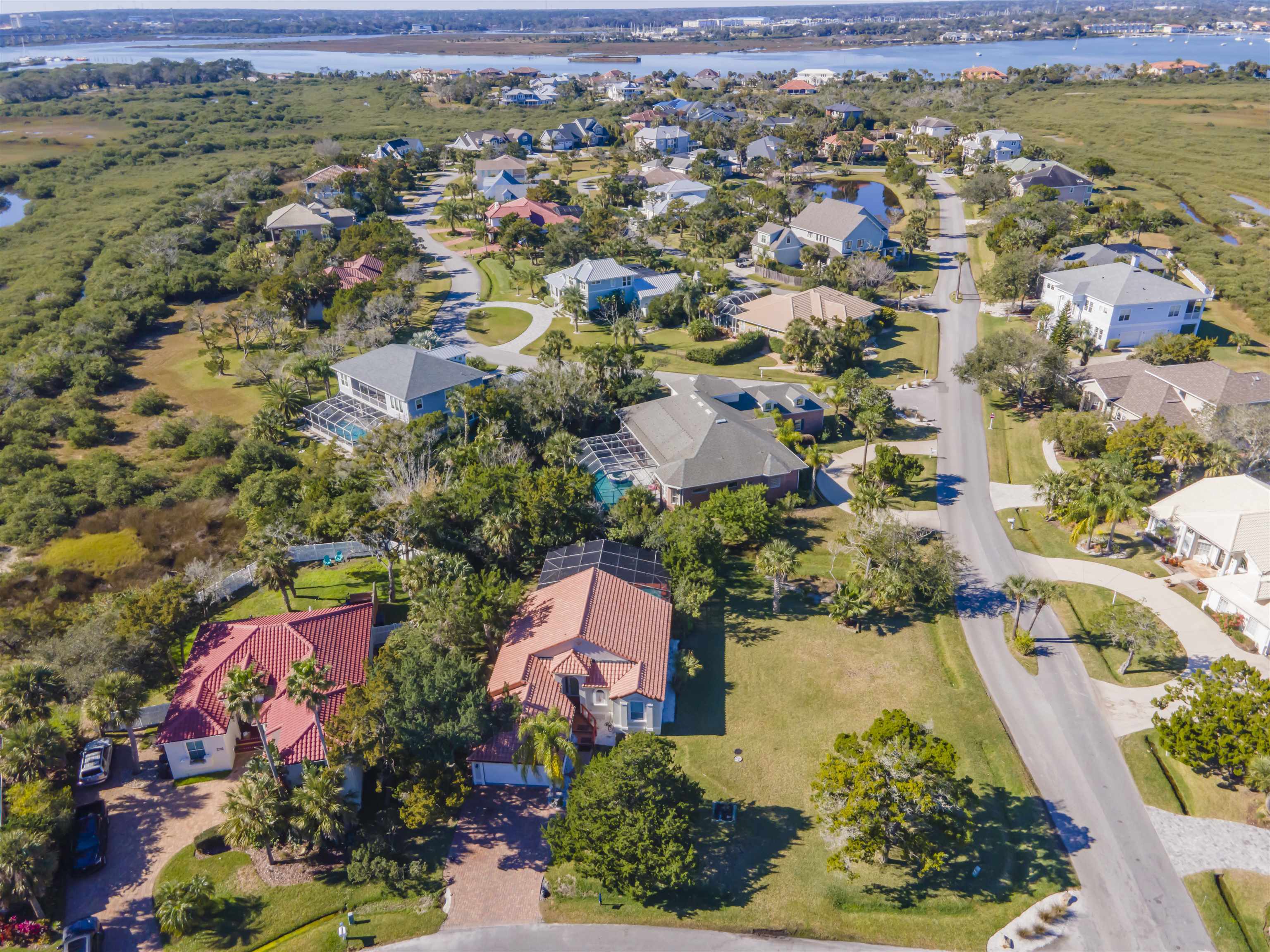 an aerial view of residential house with outdoor space and swimming pool