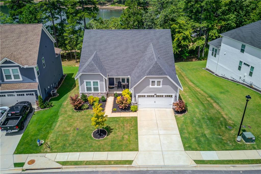 an aerial view of a house with yard