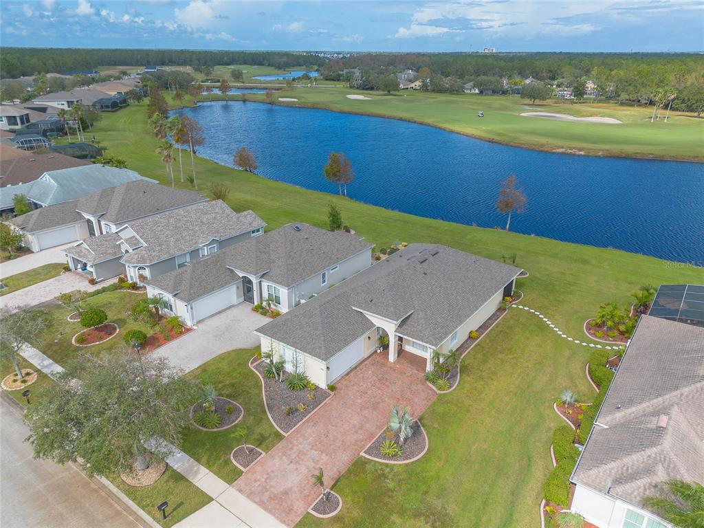 an aerial view of a house with a lake view