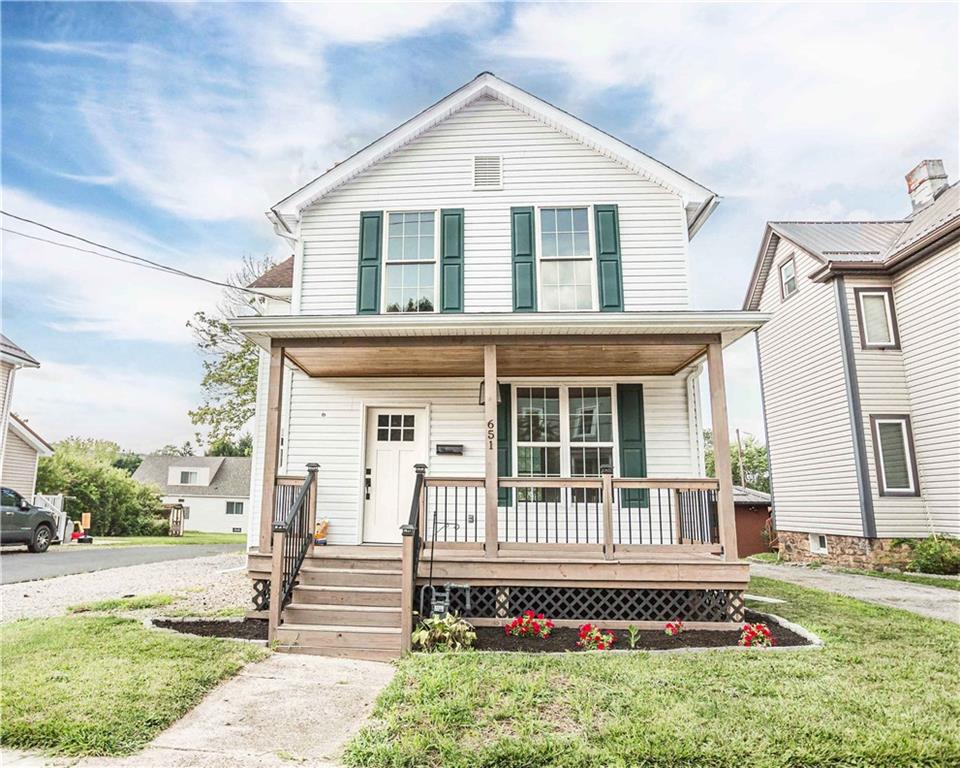 front view of a house with a yard