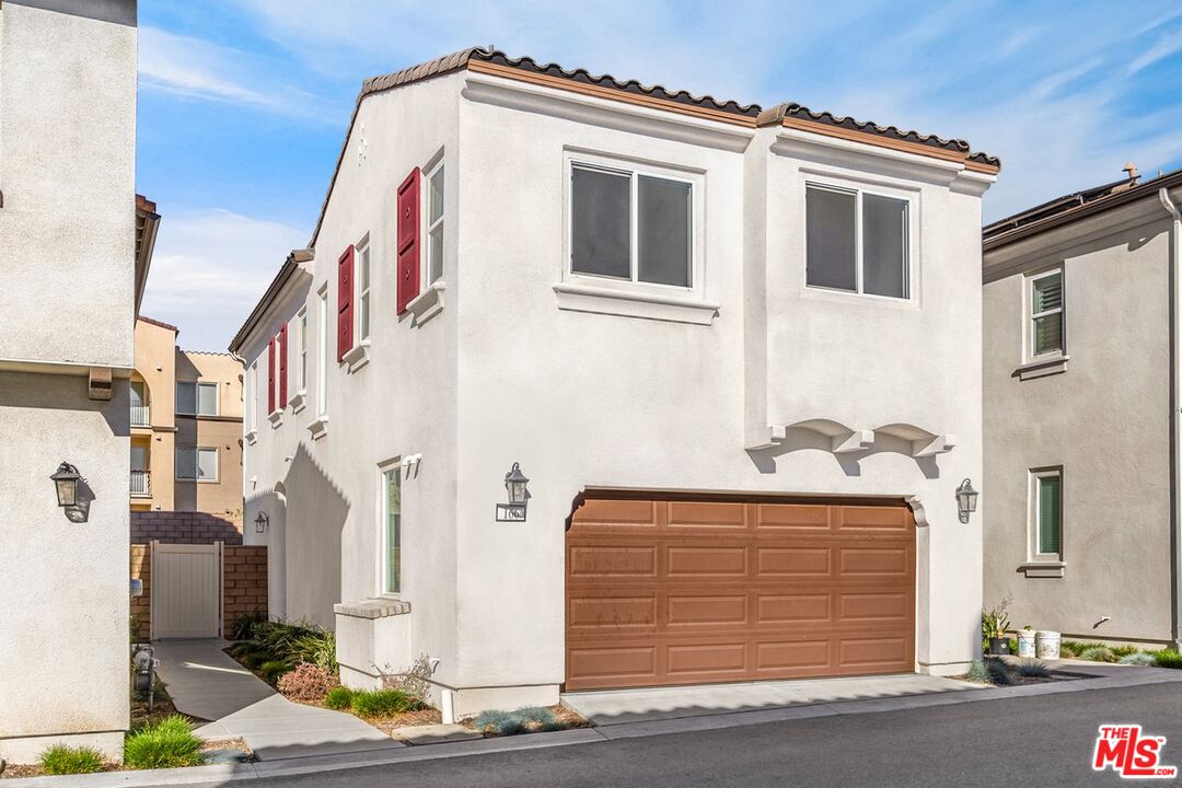 a front view of a house with garage