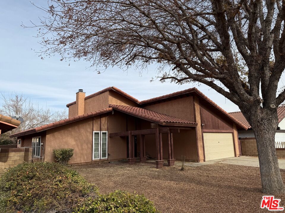 a house with trees in the background