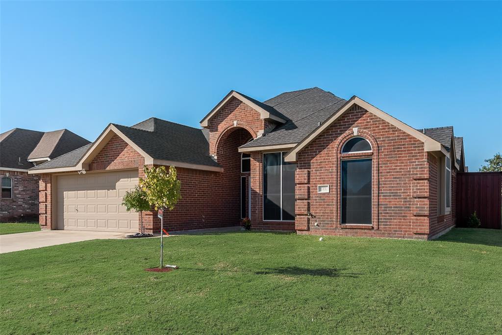 front view of a house with a yard