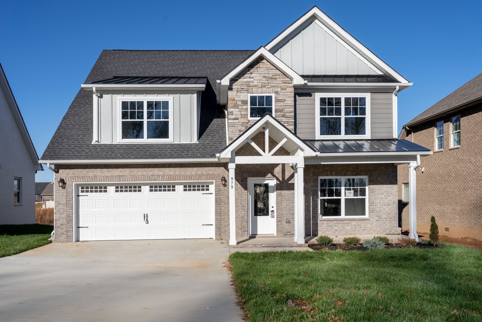 a front view of a house with a yard