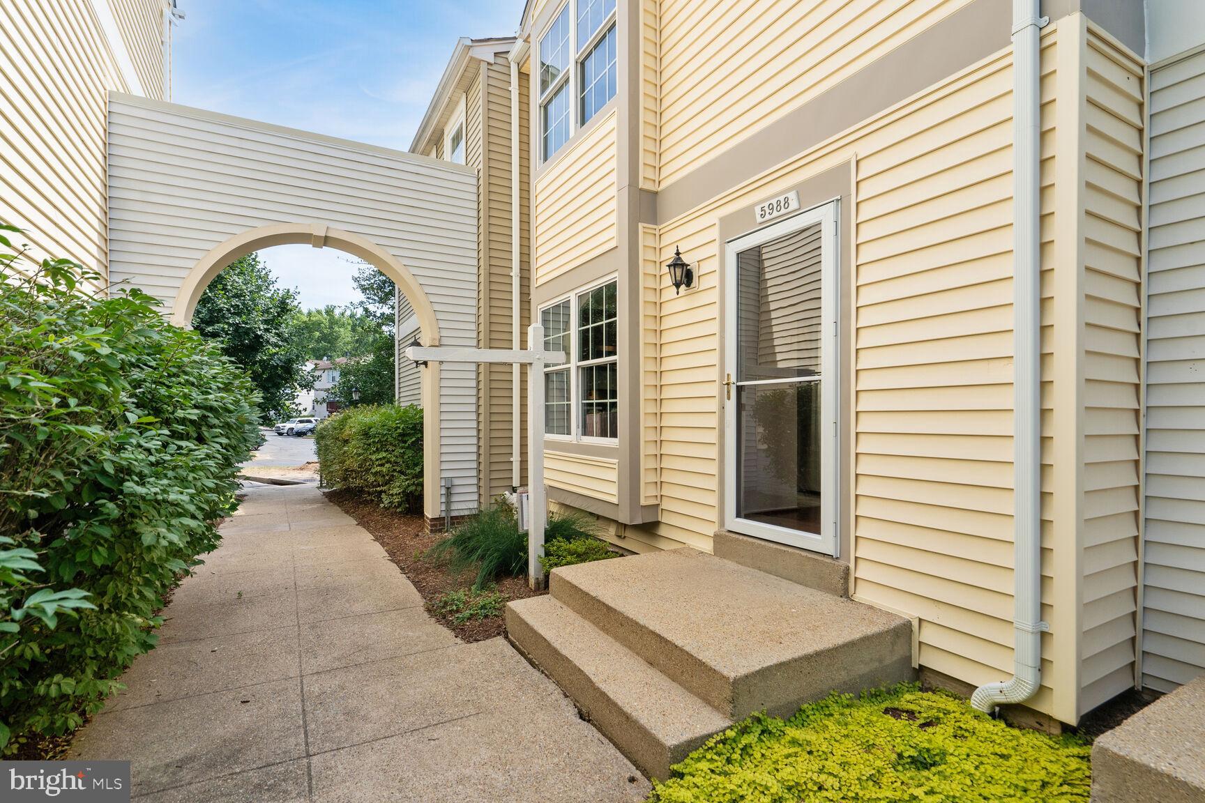 a view of a pathway with a house