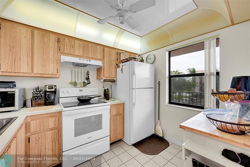 a kitchen with stainless steel appliances a stove a refrigerator sink and cabinets