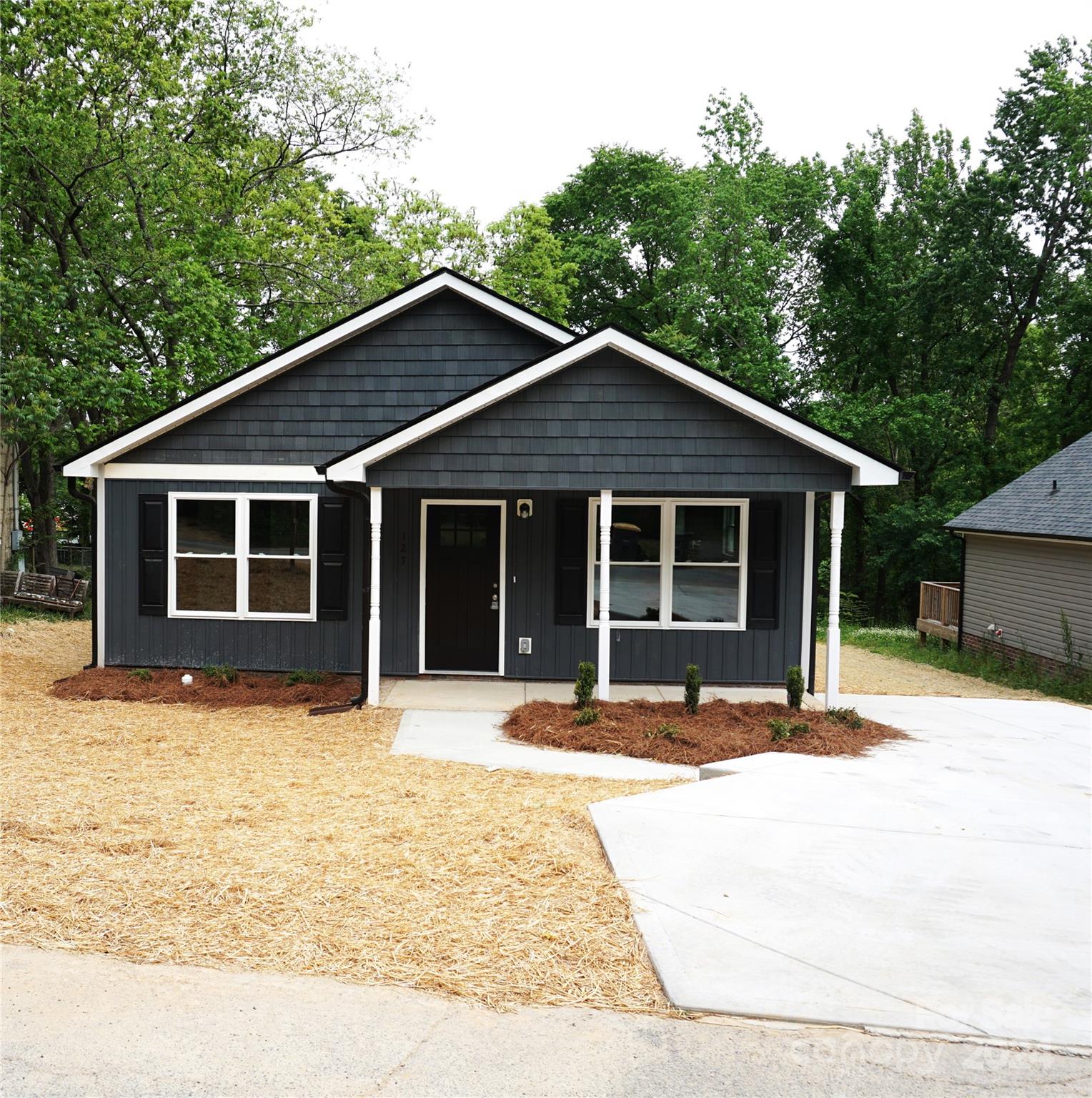 a house with trees in the background