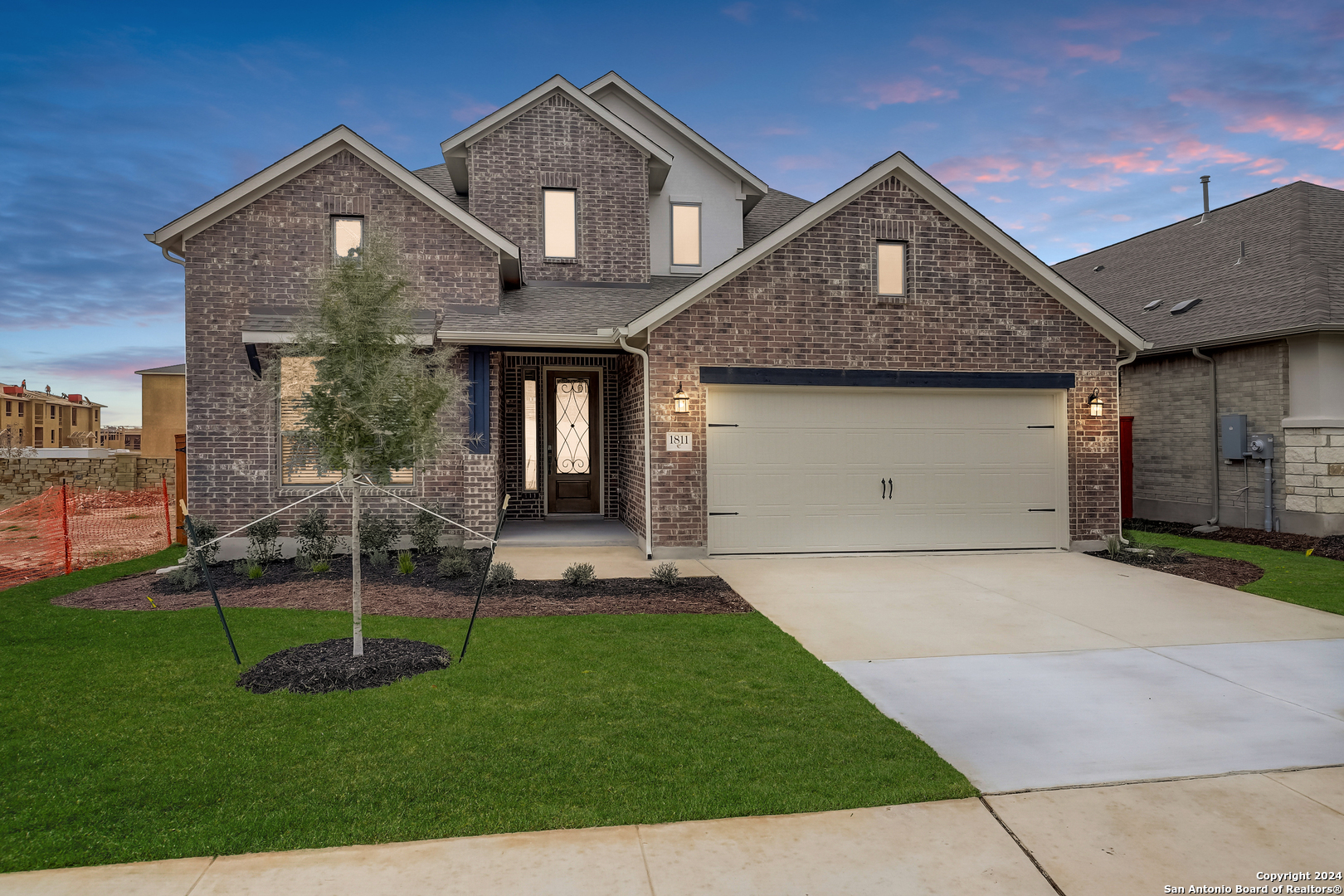 a front view of a house with a yard