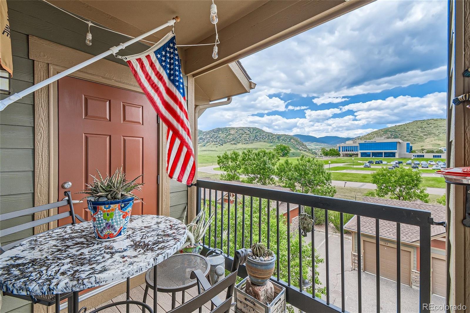 a balcony view with a seating space