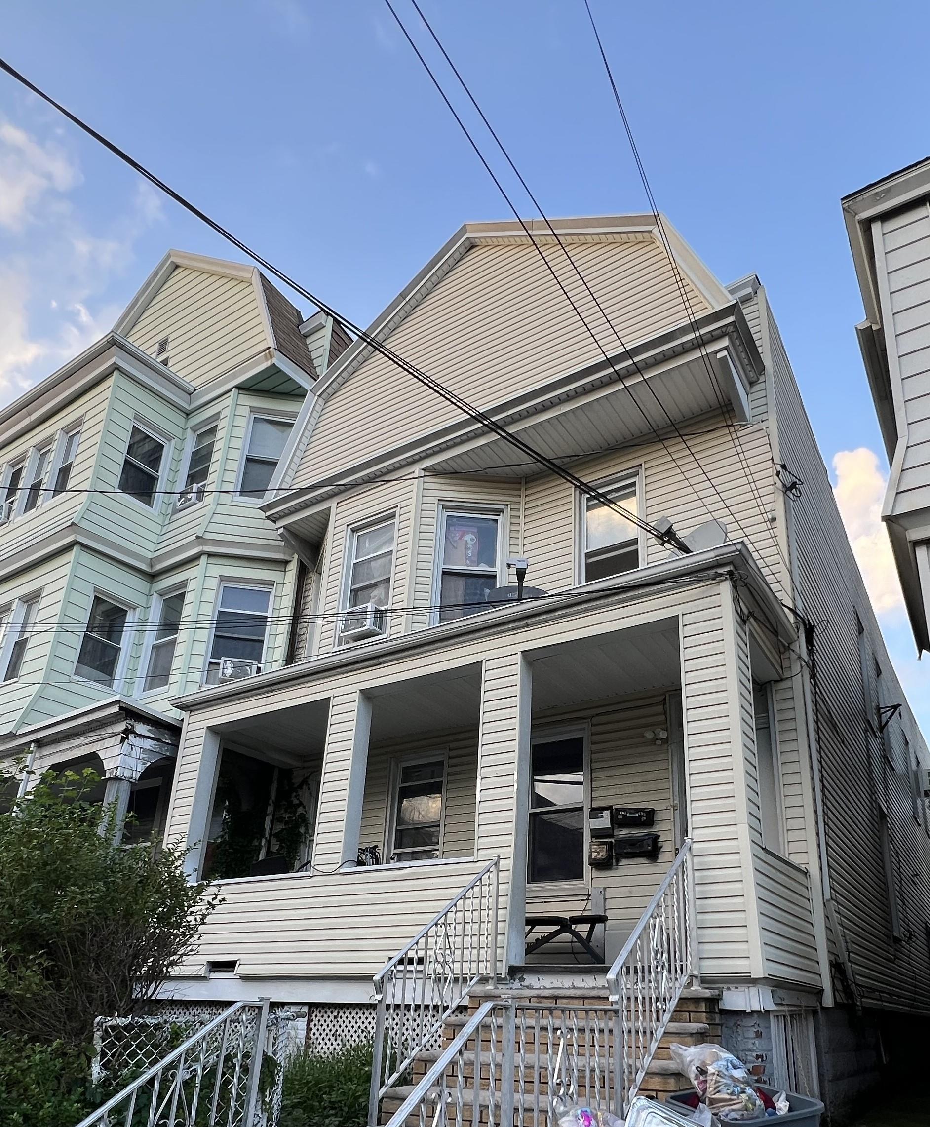 a view of a house with a door and balcony