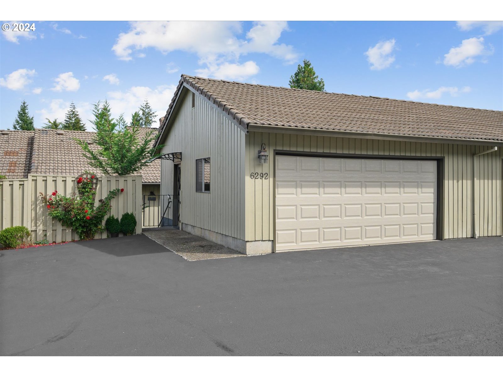 a view of a house with a garage