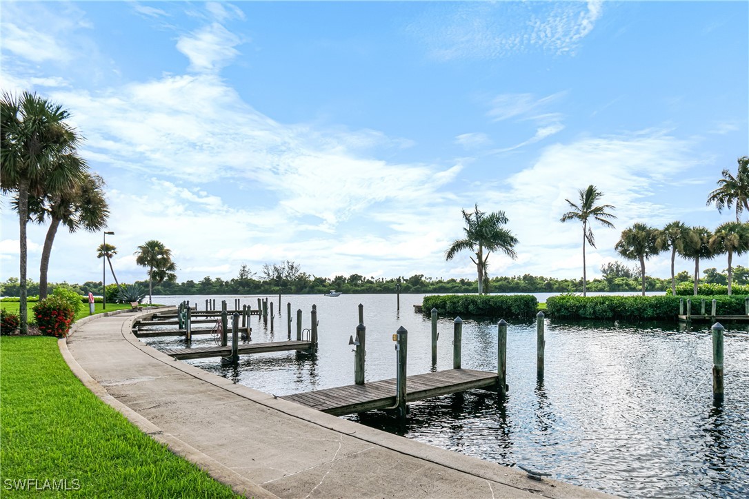 a view of a lake with houses in the back